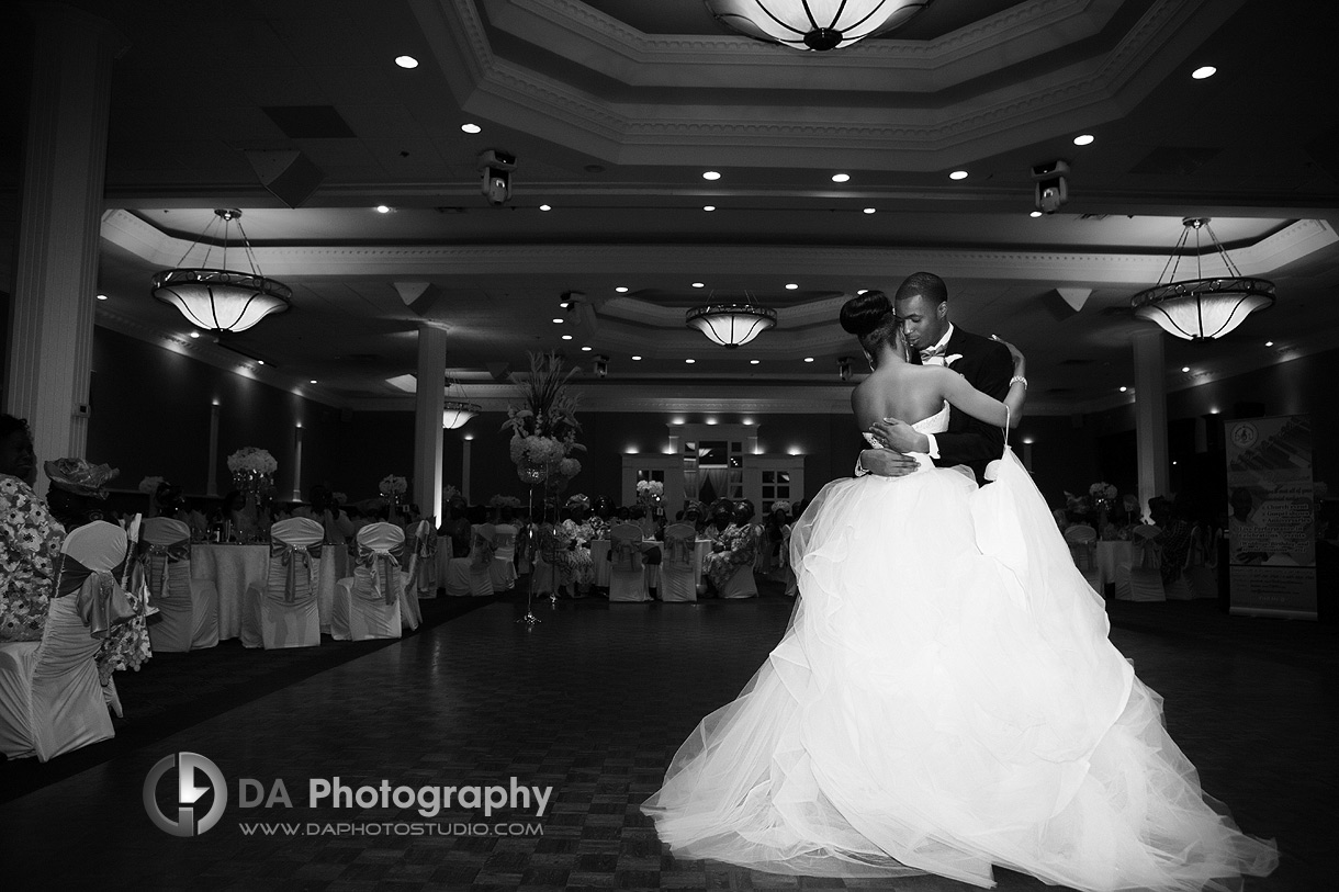 Bride and groom's first dance at their wedding reception in black and white