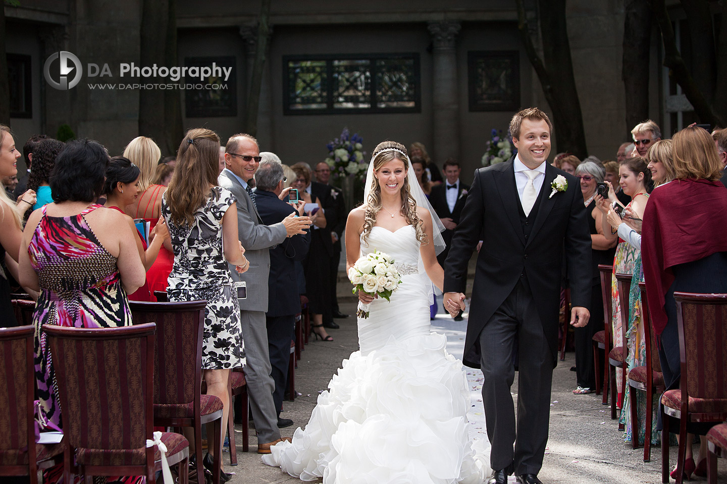 Bride and groom walking after the wedding ceremony - Wedding Photographer