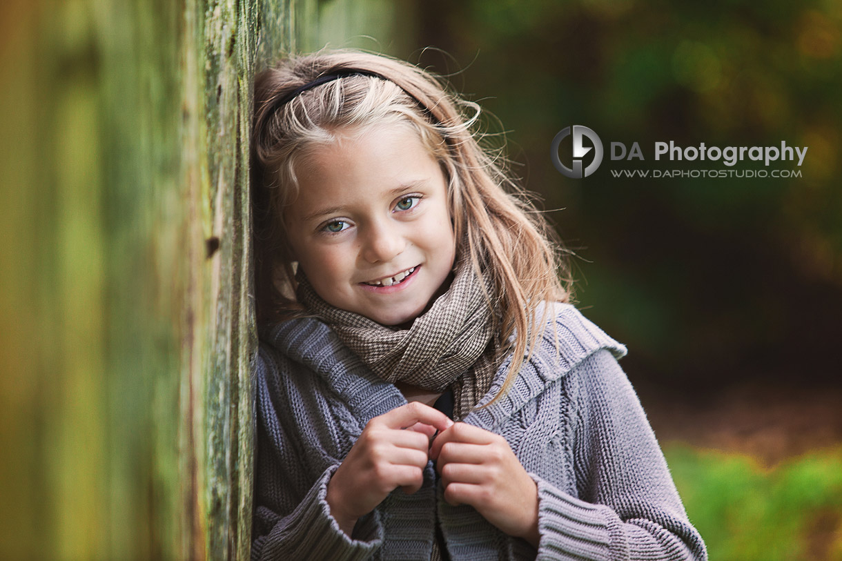 Portrait by the fence  in Fall - Children Photographer