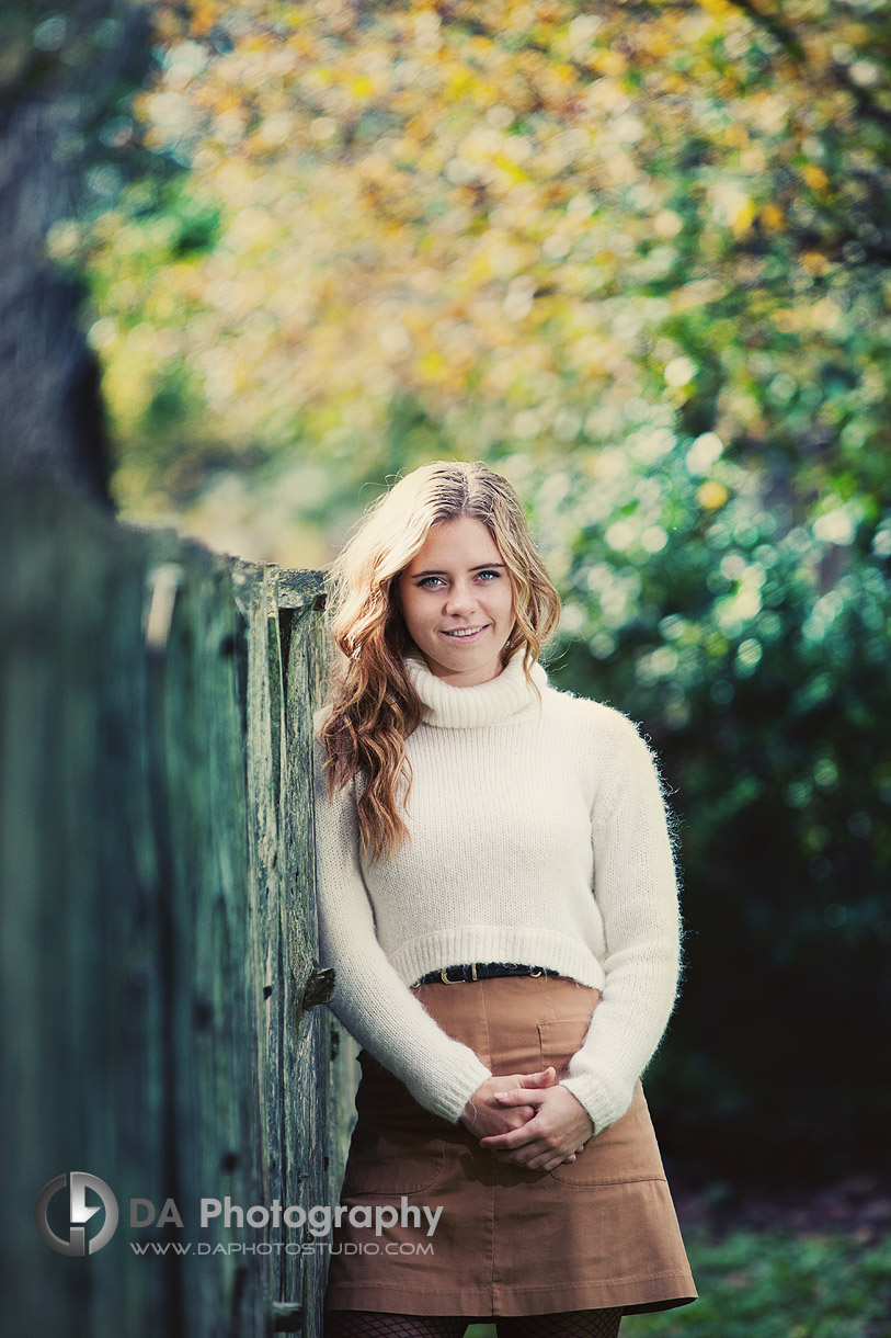 By the fence in Fall, Portrait in of Teen with great bokeh effect - High School Photographer, we travel