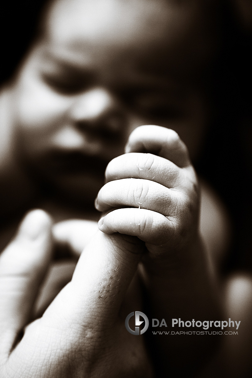 Newborn baby hold onto his mom finger - Newborn Local Photographer