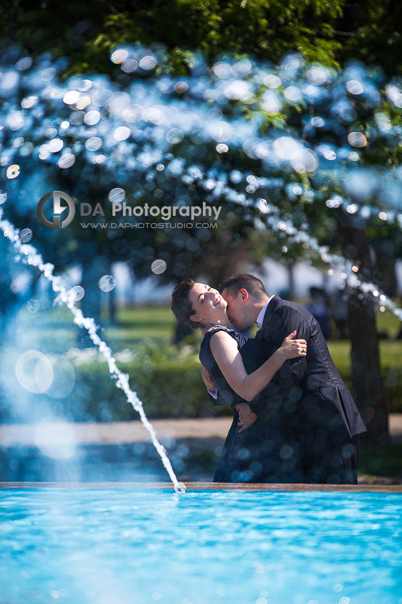 Two in love captured through water fountain - Toronto Island Wedding Photographer