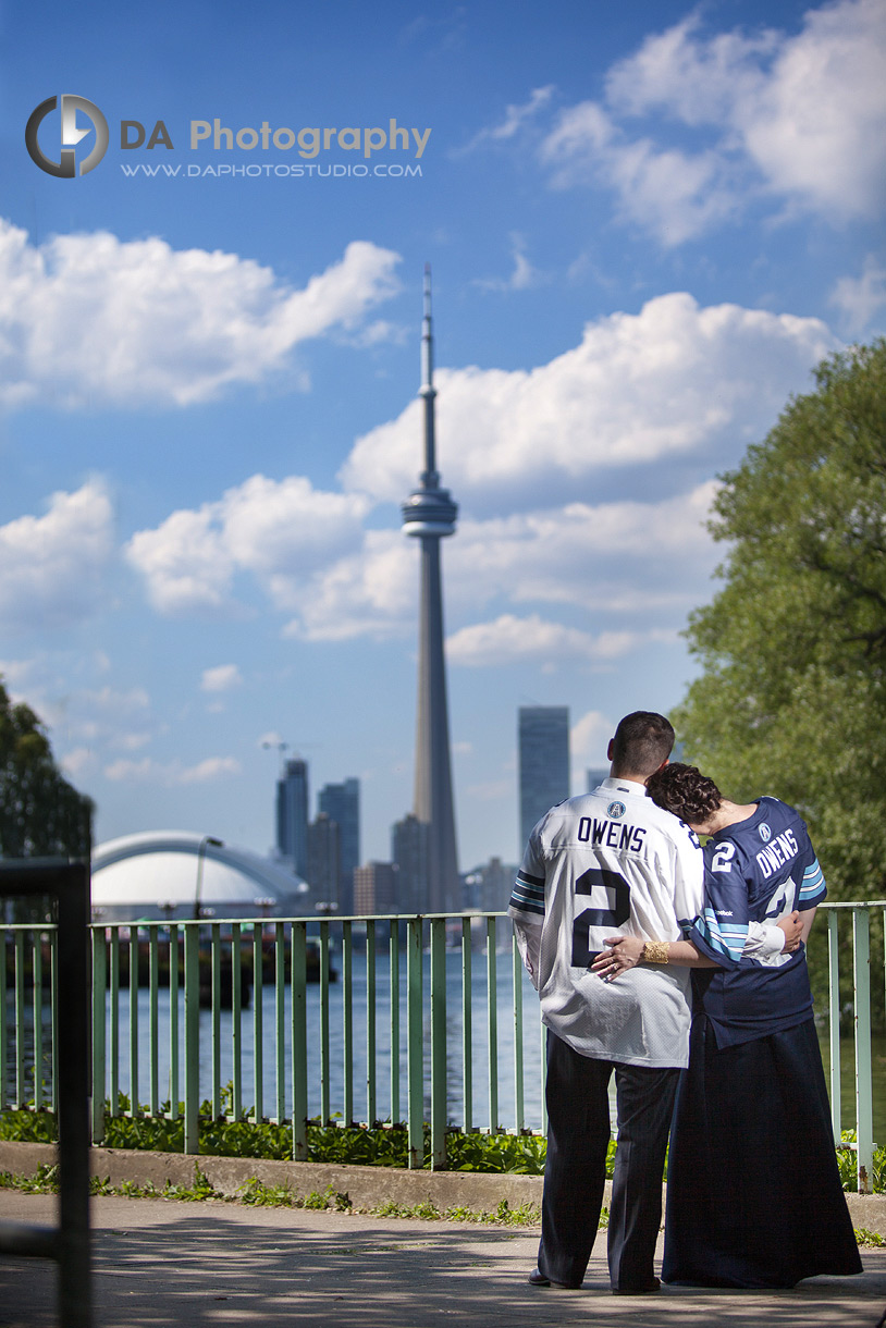 Couple with Toronto Skyline at their background - Sport Theme - Toronto Island Wedding Photographer