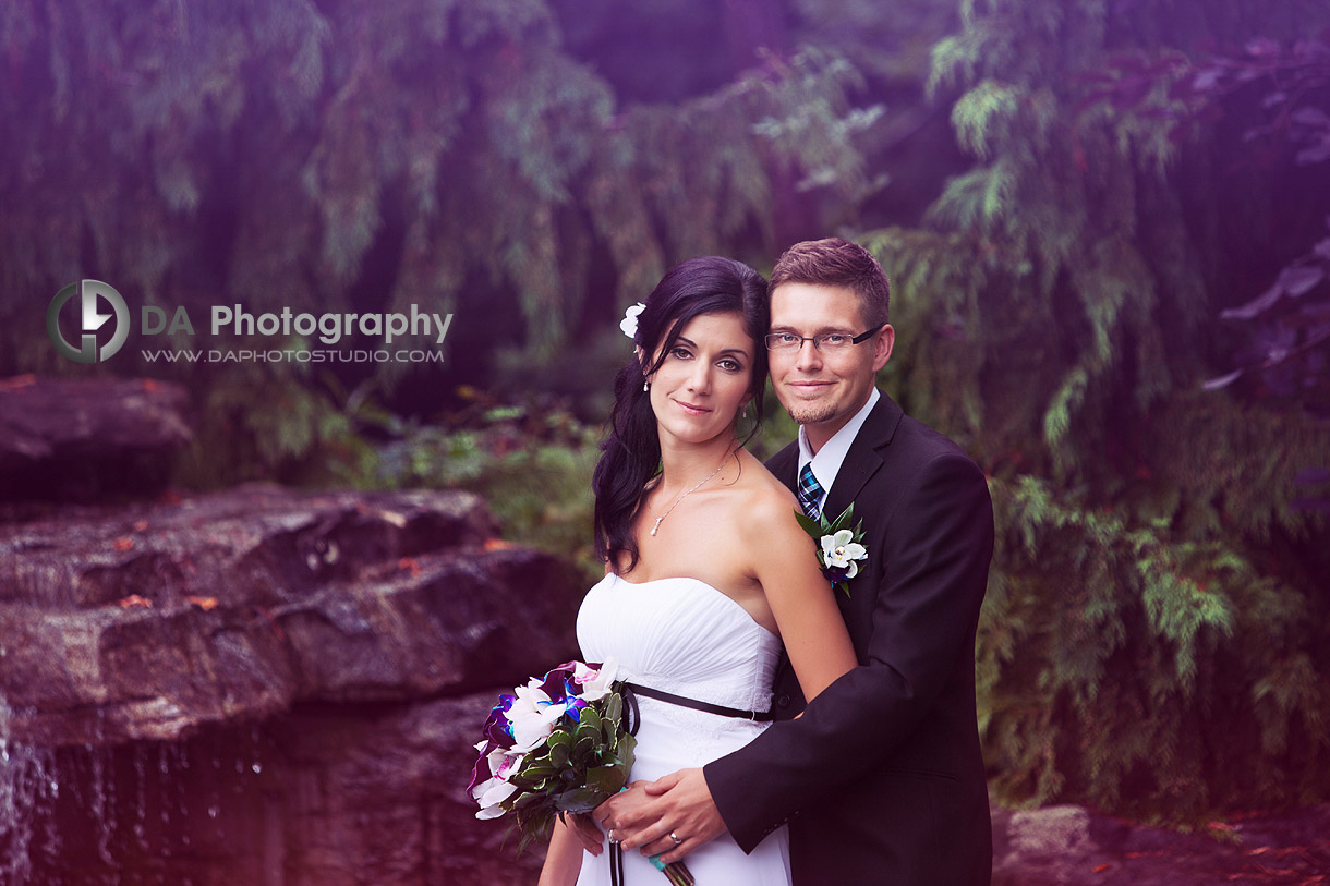 Bride and groom by the water fountain - Local Wedding Photographer - Terrace on the Green  - Wedding Venue