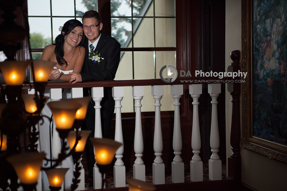 Bride and groom by the chandelier - Wedding Photographer -  Terrace on the Green  - Wedding Venue