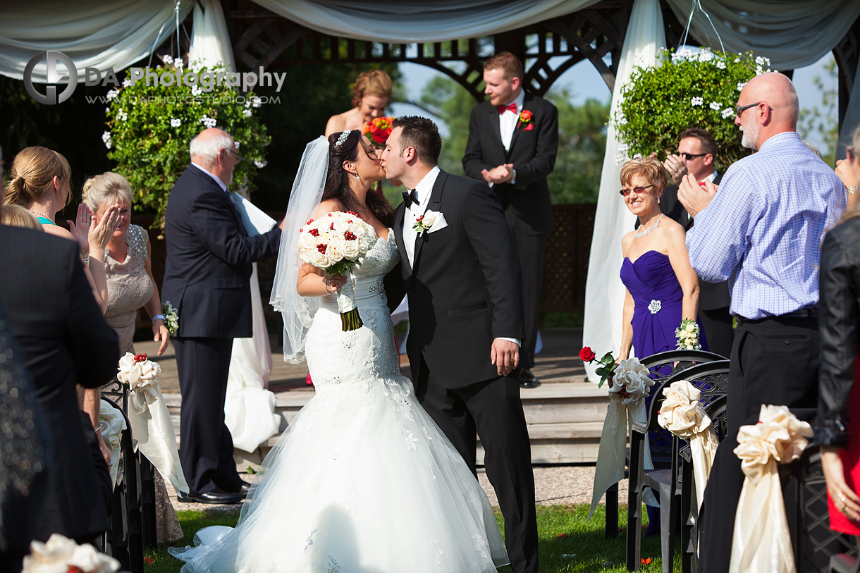 Bride and Groom Ceremony Kiss - Wedding Photography by Dragi Andovski - Terrace On The Green - Brampton, ON