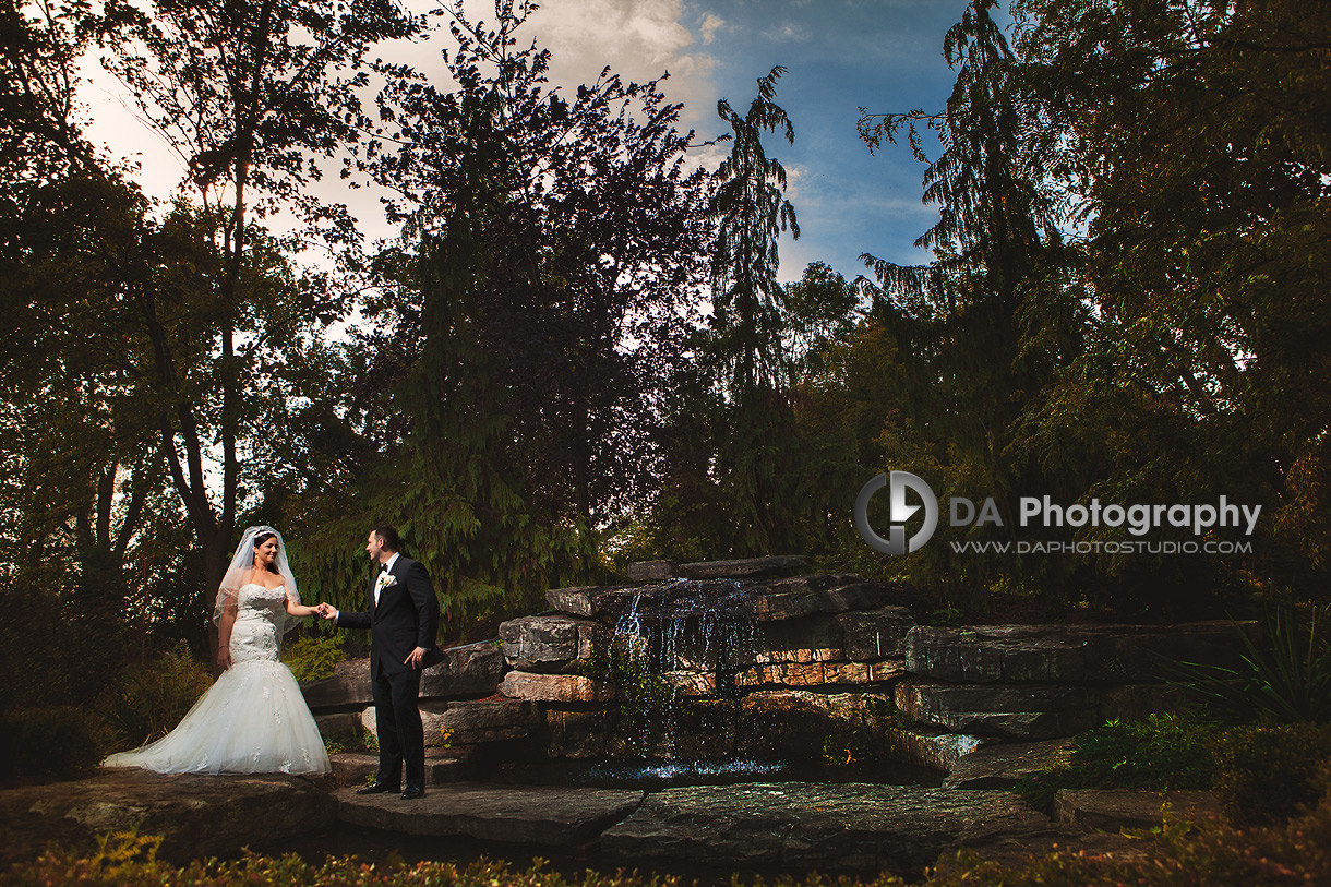 Bride and Groom by Waterfall - Wedding Photography by Dragi Andovski - Terrace On The Green - Brampton, ON
