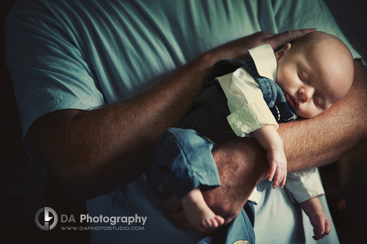 Baby Boy in Daddy's Arms - Newborn Photography by Dragi Andovski - www.daphotostudio.com
