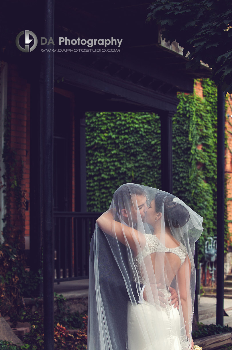 Bride and Groom Kiss Under Veil - Wedding Photography by Dragi Andovski - Hamilton, ON
