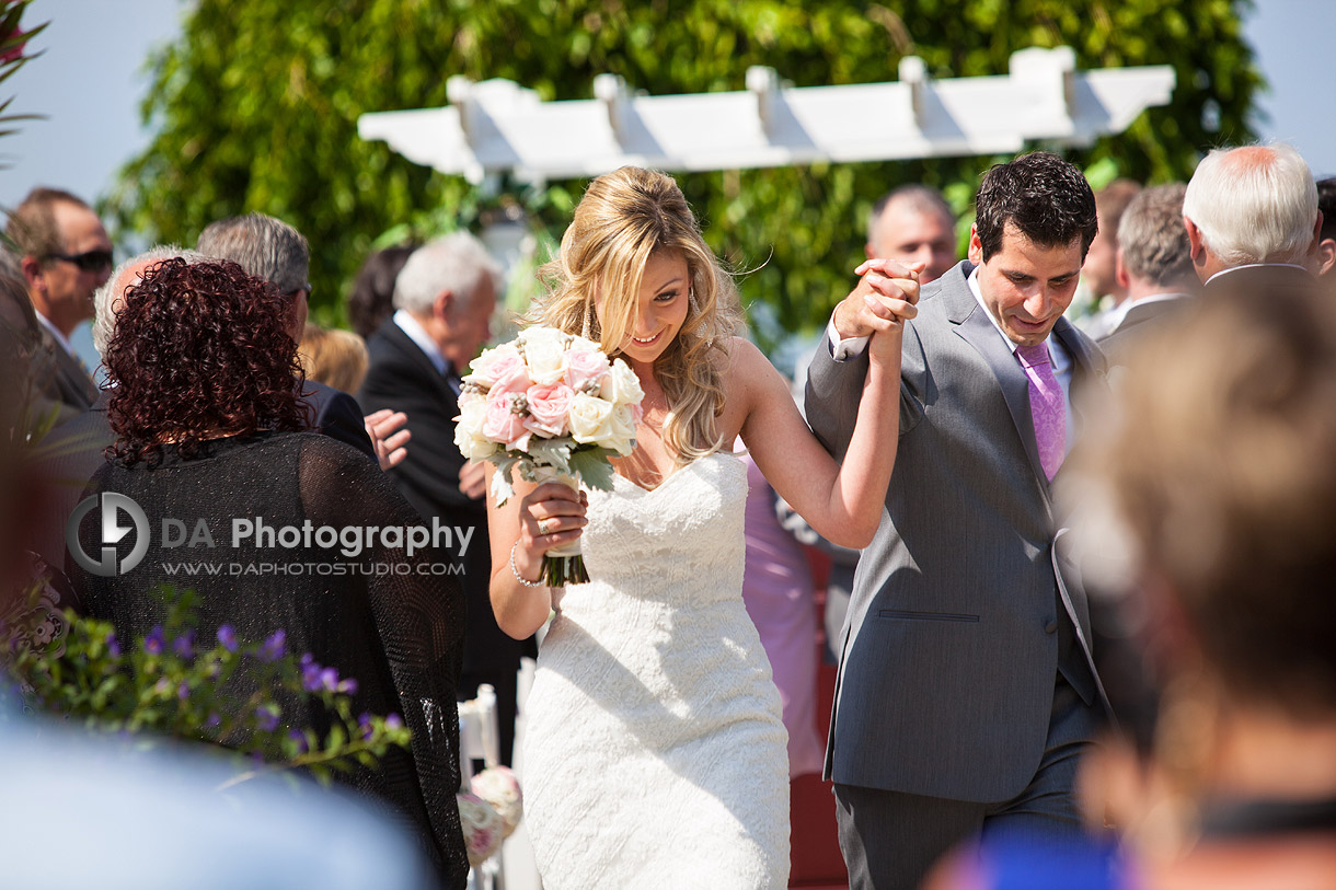 Bride and Groom coming down the aisle - Wedding Photography by DA Photography - Edgewater Manor - Stoney Creek, ON