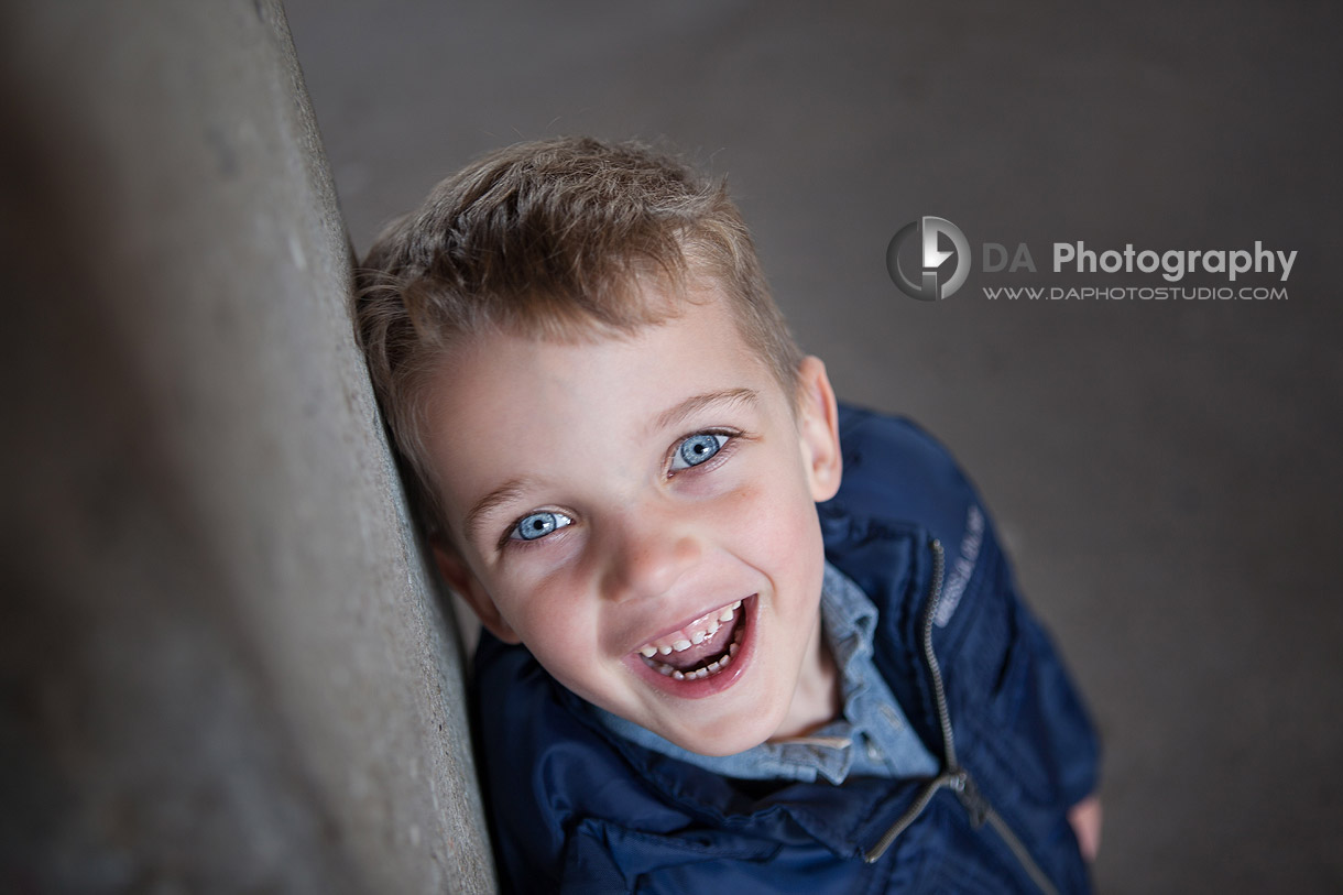 Playful portrait of boy before entering lake ferry - DA Photography at Toronto Islands, www.daphotostudio.com