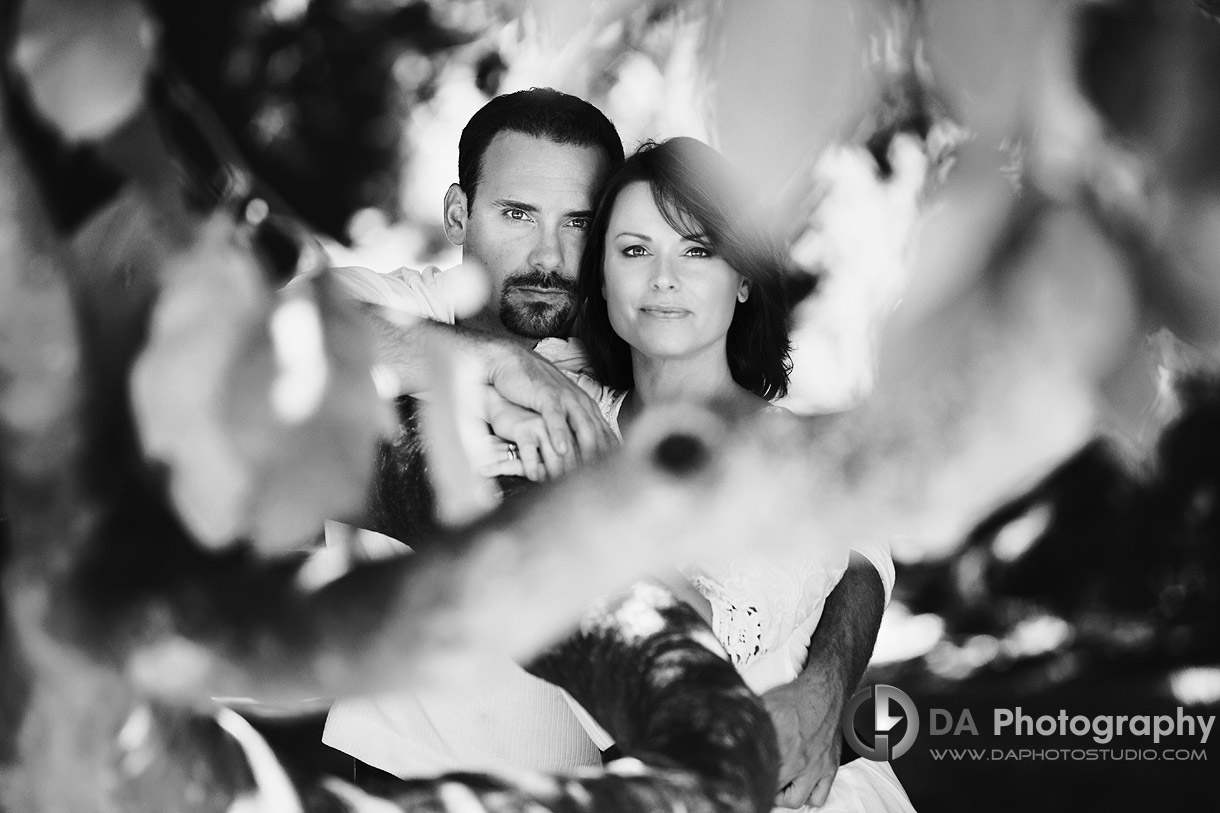 Couple portrait through the leaves - at Gairloch Gardens, Oakville by DA Photography , www.daphotostudio.com