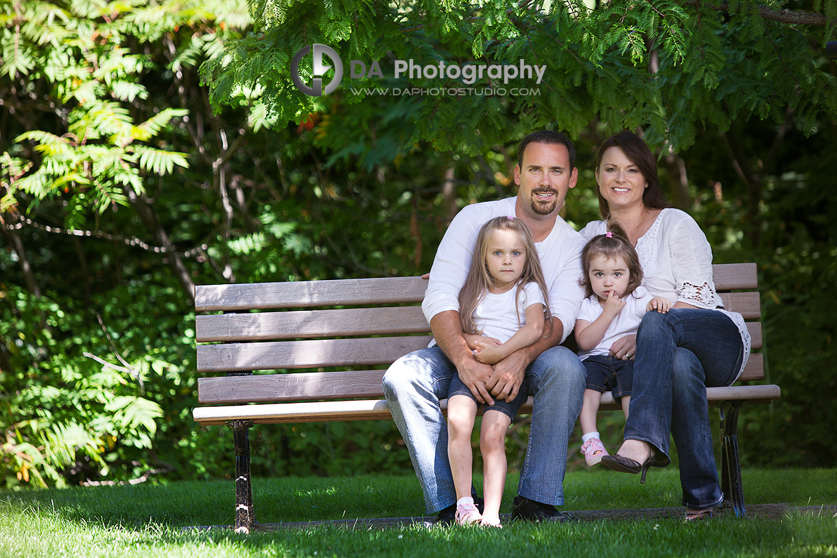 Family portrait on a bench - at Gairloch Gardens, Oakville by DA Photography , www.daphotostudio.com