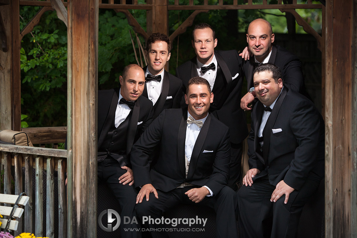 Groom with his groomsmen's under the gazebo on a rainy day - Wedding Photography by Dragi Andovski at Erchelss Estate, Oakville