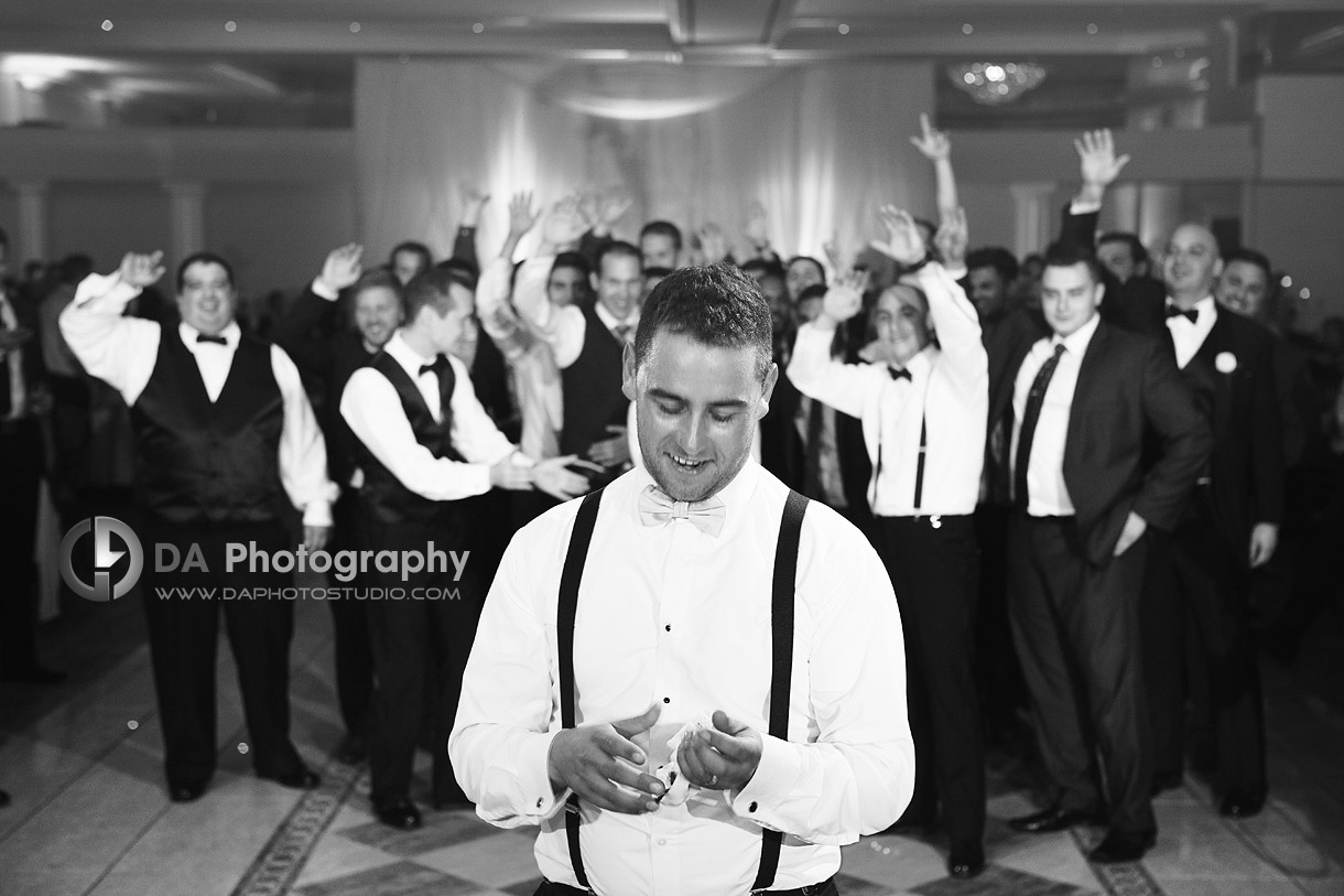 Groom getting ready for the garter toss - Wedding Photography by Dragi Andovski at Erchelss Estate, Oakville