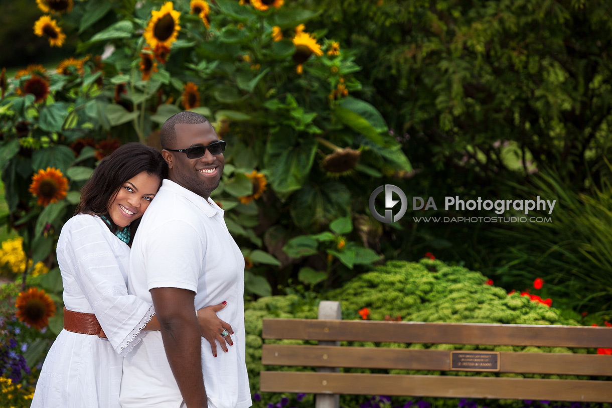 Portrait by the sunflowers - Engagement by DA Photography at Gairloch Gardens, ON, www.daphotostudio.com