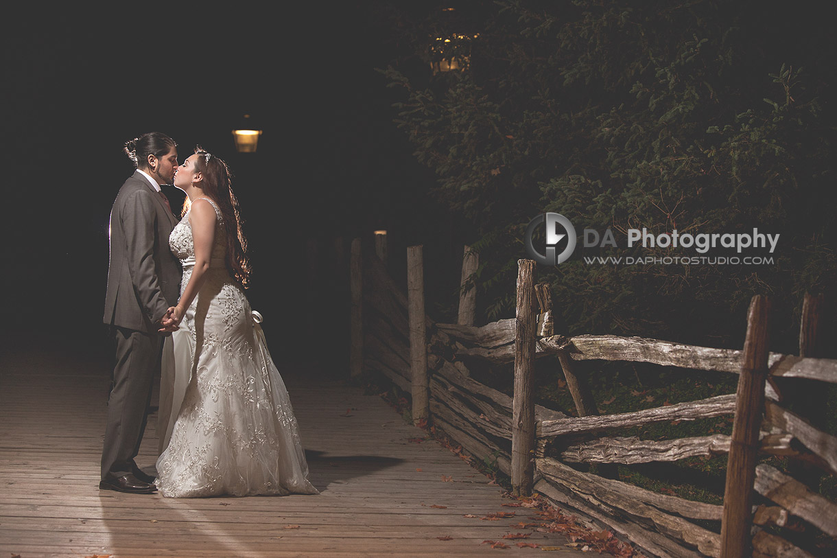 Groom and Bride kiss under the stars - by DA Photography at Black Creek Pioneer Village, www.daphotostudio.com