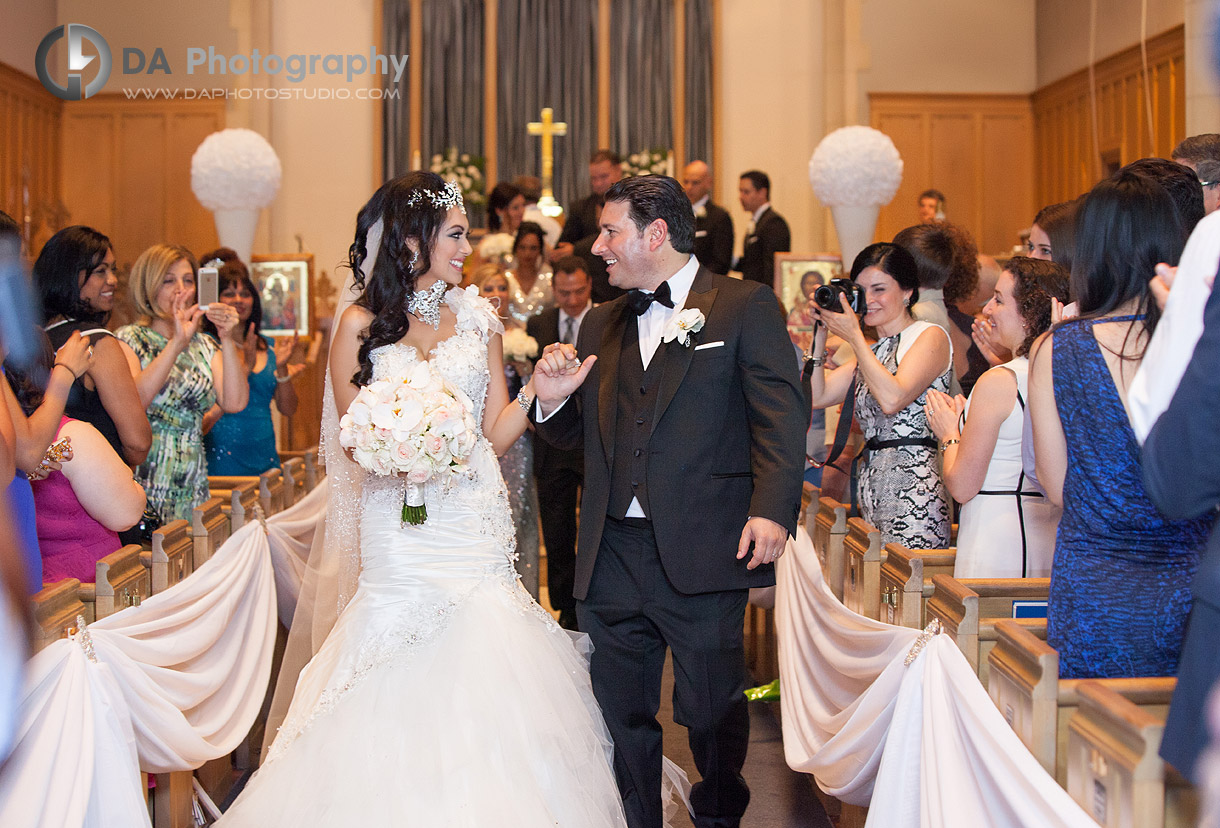 Bride and groom walking down the aisle - by DA Photography at West River, www.daphotostudio.com