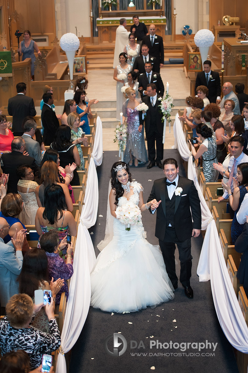 Bride and groom walking down the aisle with their bridal party - by DA Photography at West River, www.daphotostudio.com