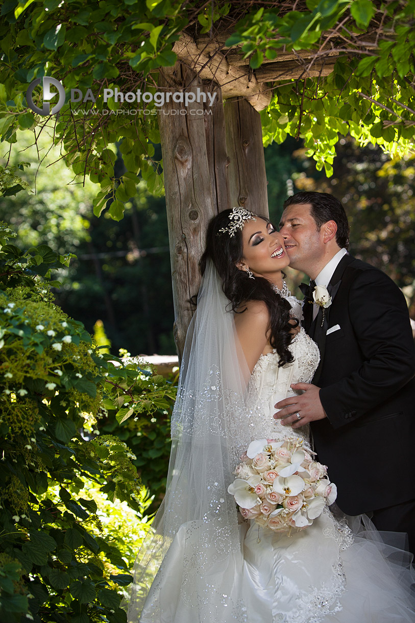 Bride and groom in a park under the ivy tree - by DA Photography at West River, www.daphotostudio.com