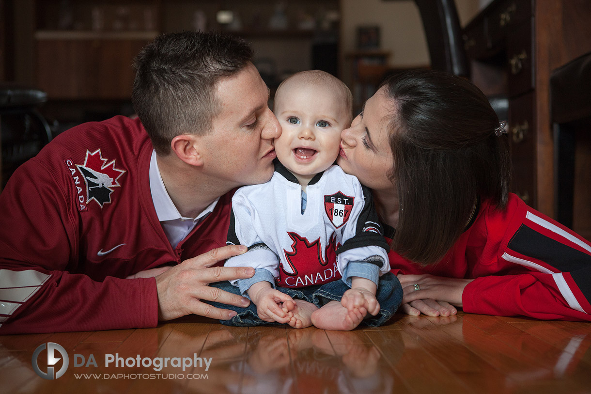 Young family with their Canada jerseys having fun- Family Photography by DA Photography at Georgetown, ON