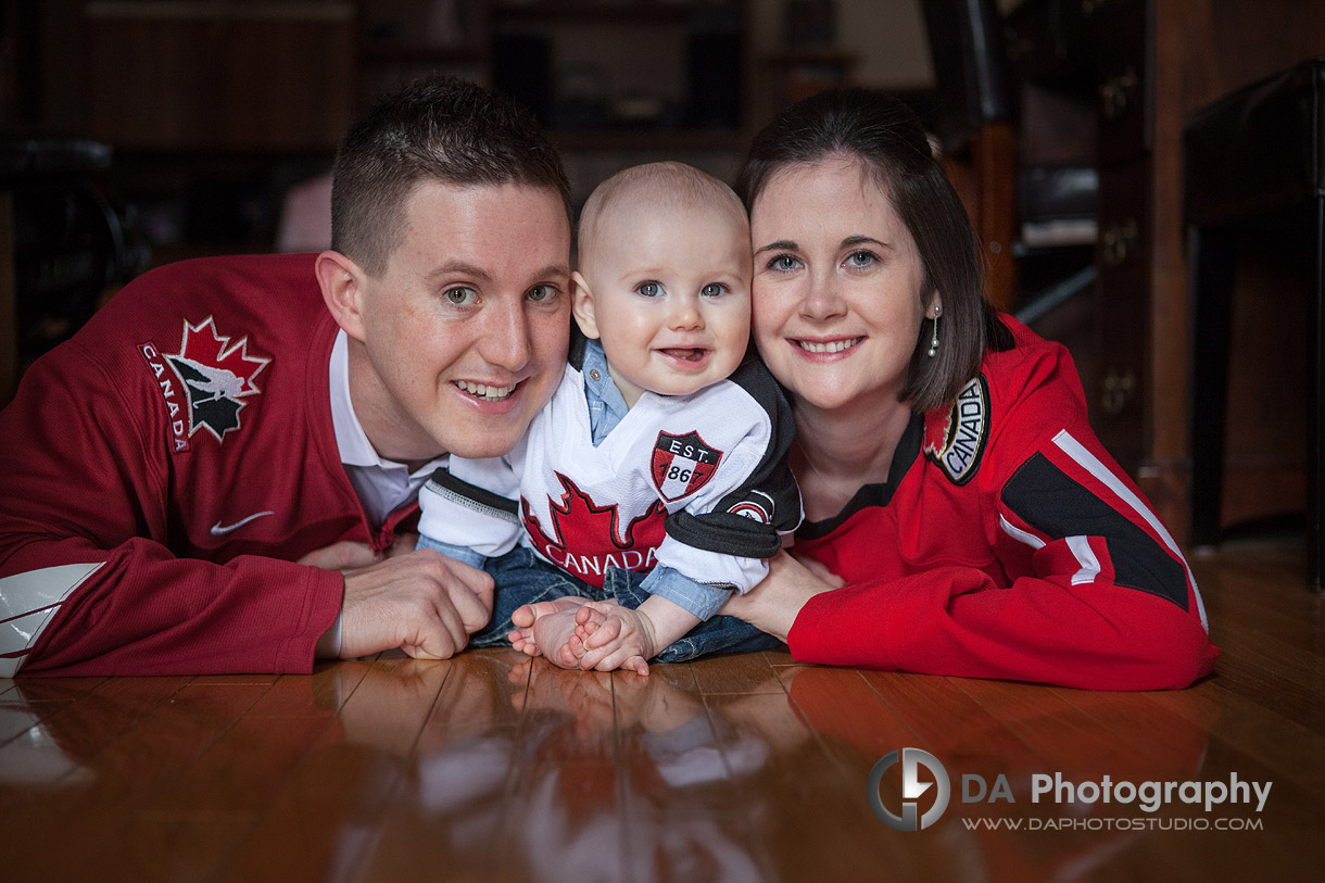 Young family with their Canada jerseys - Family Photography by DA Photography at Georgetown, ON