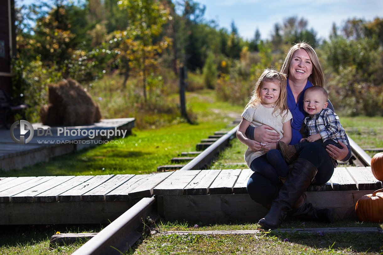 Mom with her kids at the old railroad station in Sutton - Thanksgiving Fall Portraits by DA Photography - www.daphotostudio.com