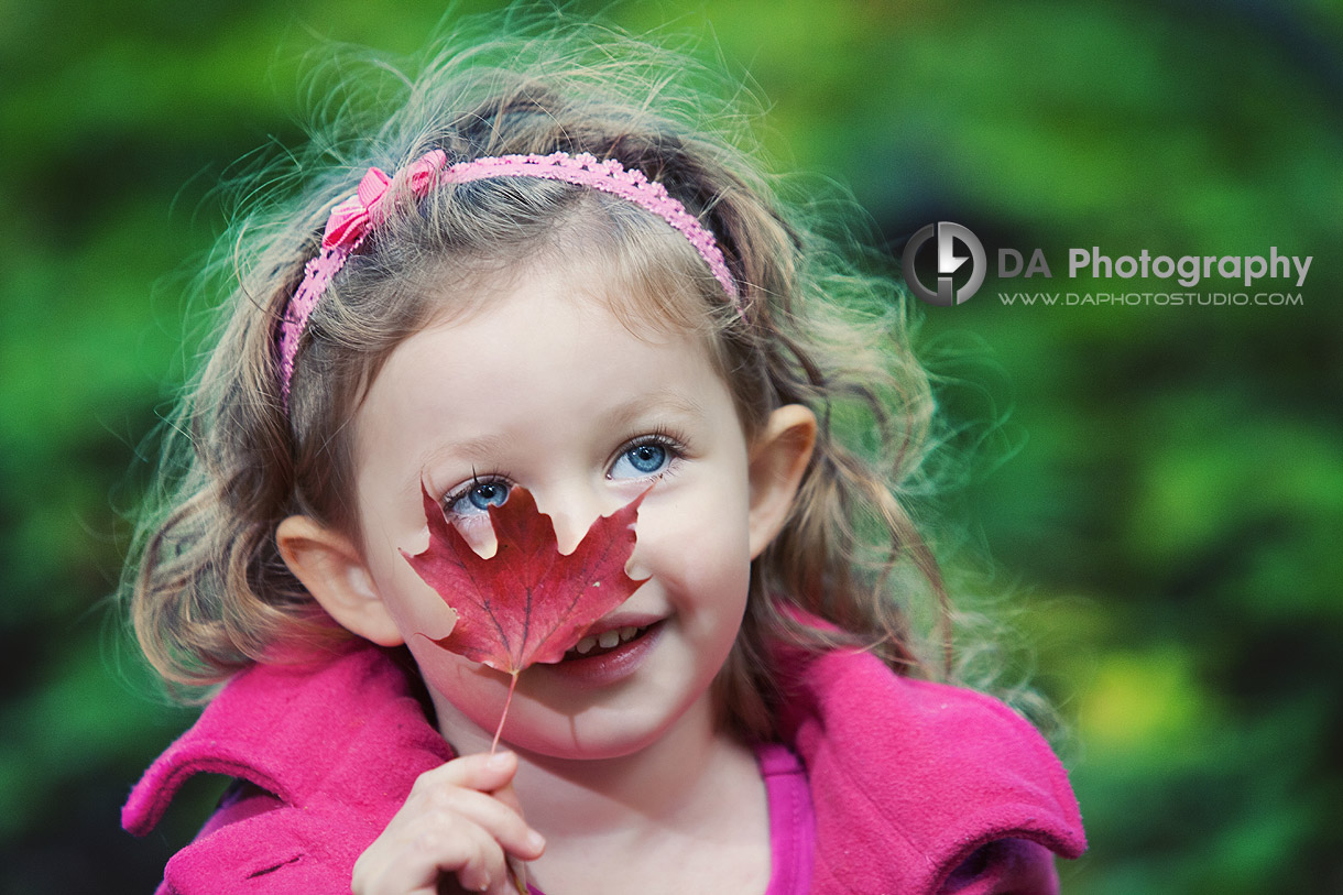 Little girl with a red maple leaf in Fall - at Heart Lake Conservation Area by DA Photography - www.daphotostudio.com