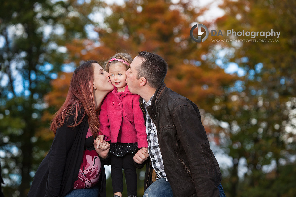 Young family in Fall having fun- at Heart Lake Conservation Area by DA Photography - www.daphotostudio.com