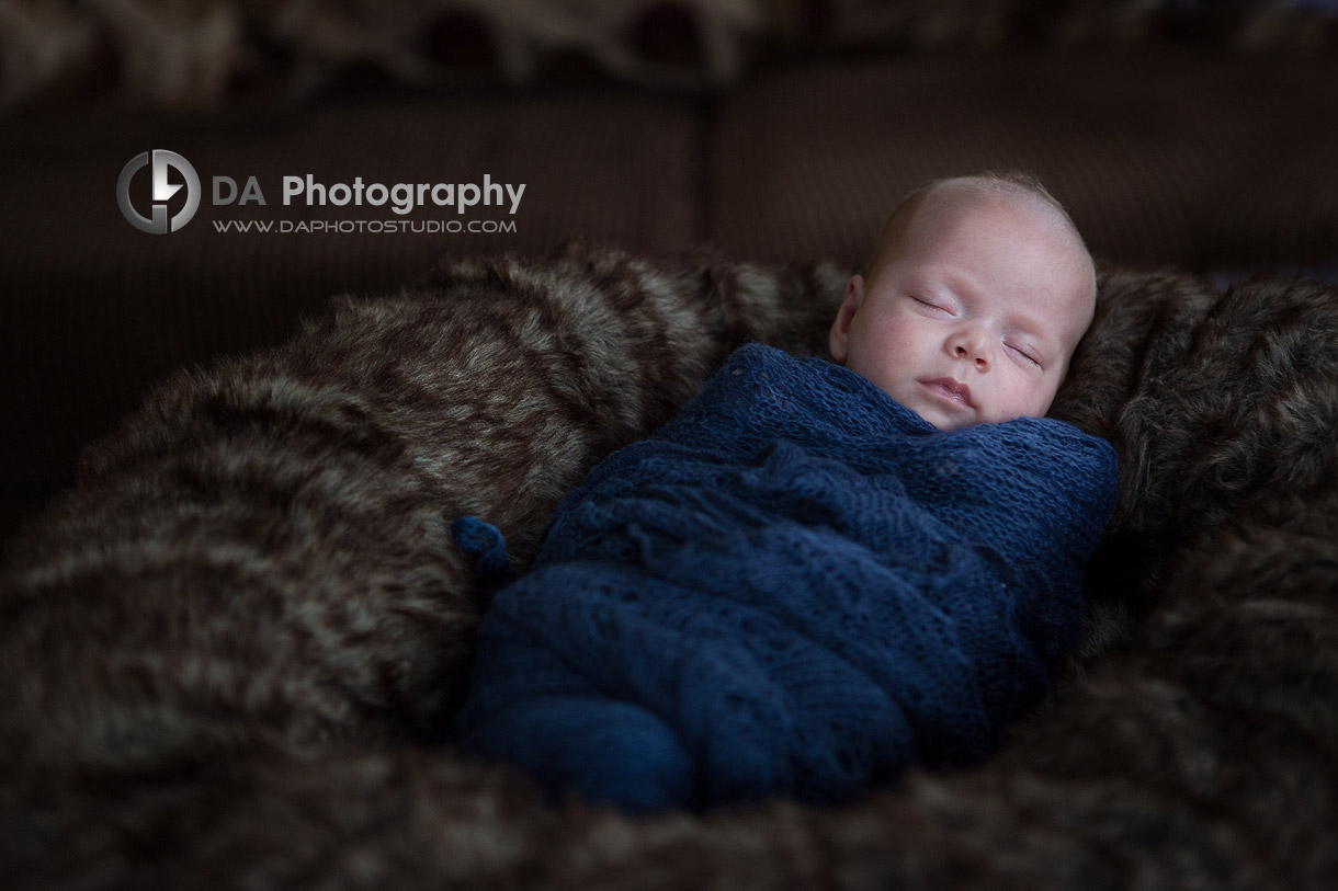 Swaddled baby in a nest - Twin Newborn babies by DA Photography - www.daphotostudio.com