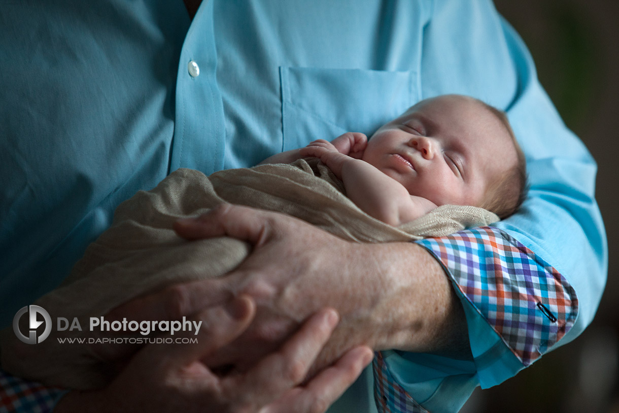 In daddies hands - Twin Newborn babies by DA Photography - www.daphotostudio.com
