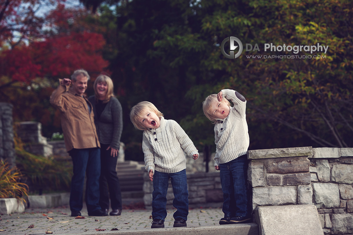 Brothers and their dinosaur gestures, parents help too - Professional photos by DA Photography at Paletta Mansion, Burlington - www.daphotostudio.com