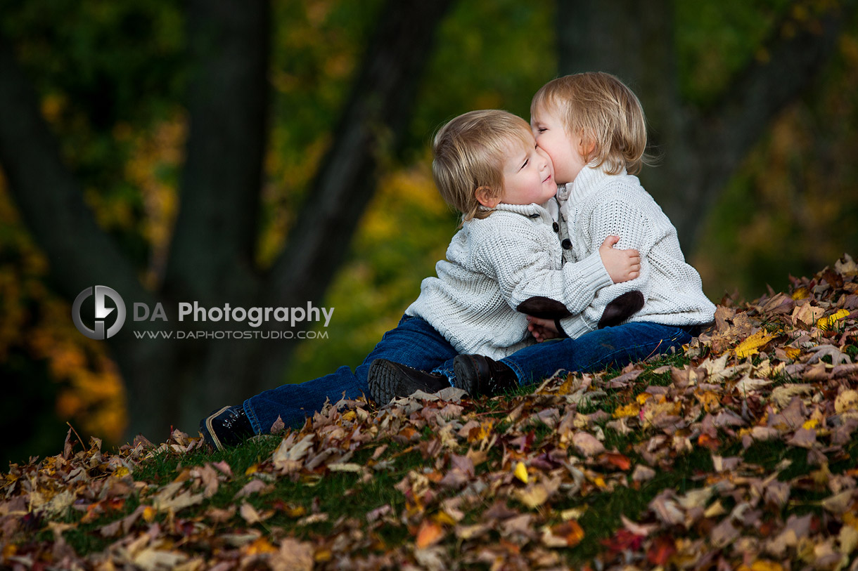 Brothers hug in Fall - Professional photos by DA Photography at Paletta Mansion, Burlington - www.daphotostudio.com