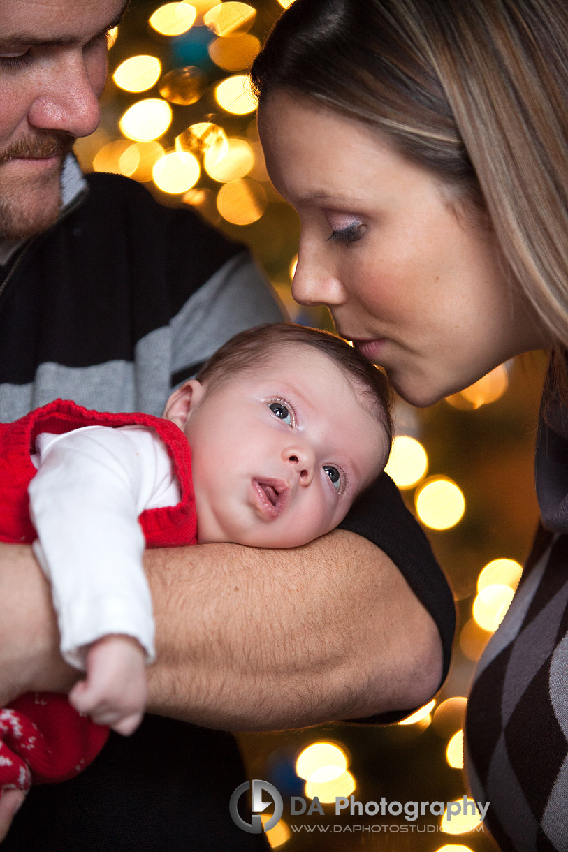 Newborn baby with her family during Christmas season - Christmas and Holiday card photos by DA Photography - www.daphotostudio.com 