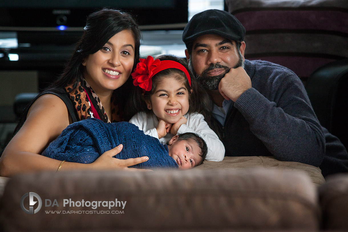A happy family with their new addition - Newborn baby photos by DA Photography - www.daphotostudio.com