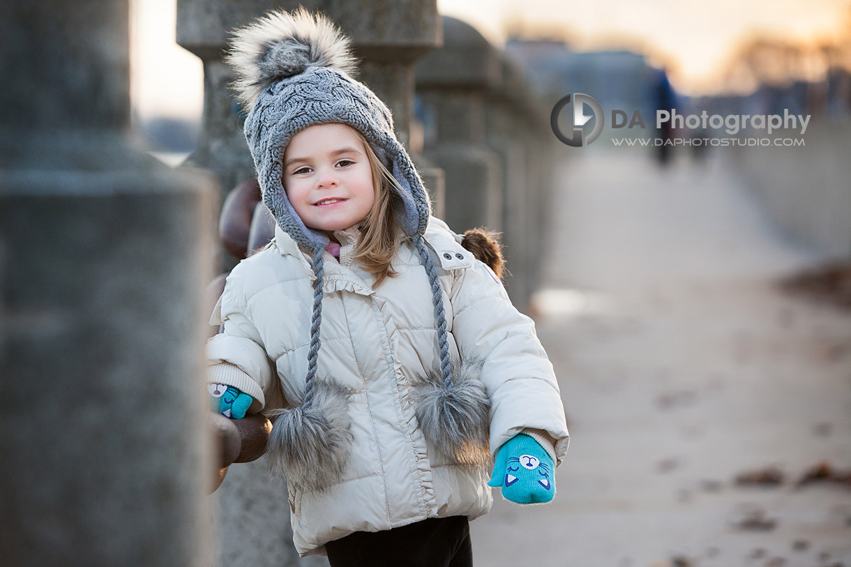 Outdoor children winter portrait by the pier - Family Photography by Dragi Andovski at Burlington Waterfront, www.daphotostudio.com