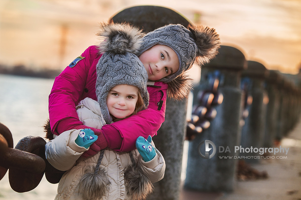 Siblings Portrait in Winter by the pier - Family Photography by Dragi Andovski at Burlington Waterfront, www.daphotostudio.com