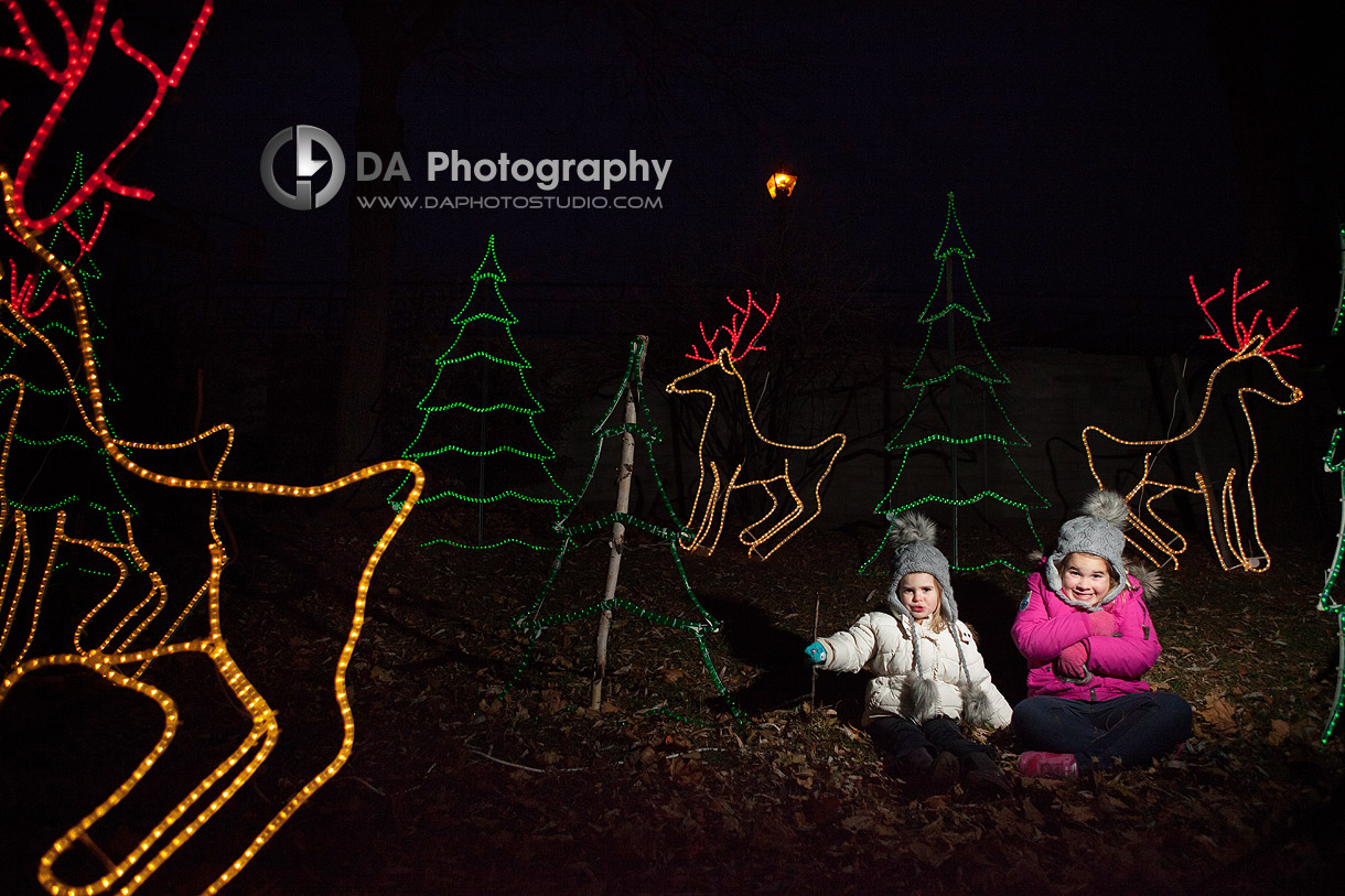 Siblings with holiday lights and decorations - Family Photography by Dragi Andovski at Burlington Waterfront, www.daphotostudio.com
