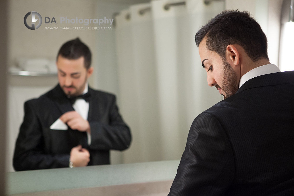 Groom getting ready, mirror reflection - Winter wedding at Liberty Grand by DA Photography , www.daphotostudio.com