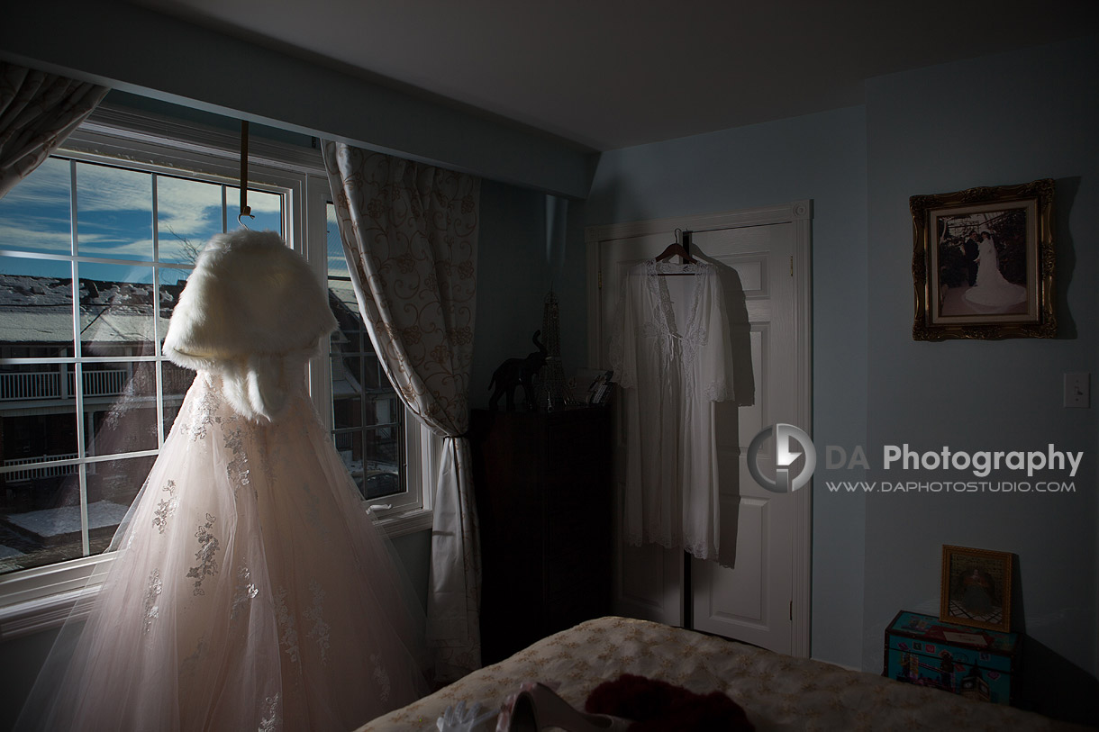 Bride's wedding dress together with photo of her mom's wedding andy her moms wedding dress - Winter wedding at Liberty Grand by DA Photography , www.daphotostudio.com