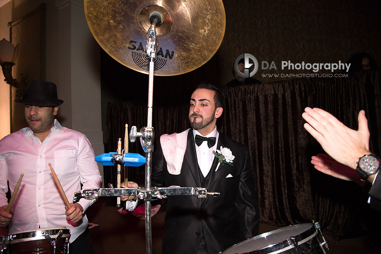 Groom drumming durning his wedding - Winter wedding at Liberty Grand by DA Photography , www.daphotostudio.com