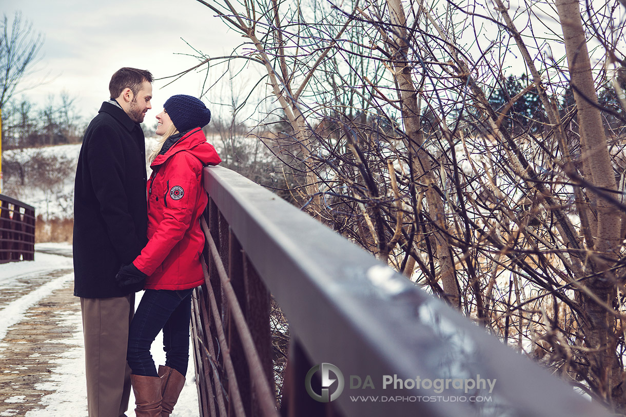 Two in love on the bridge - Winter Engagement photo shoot by DA Photography, www.daphotostudio.com