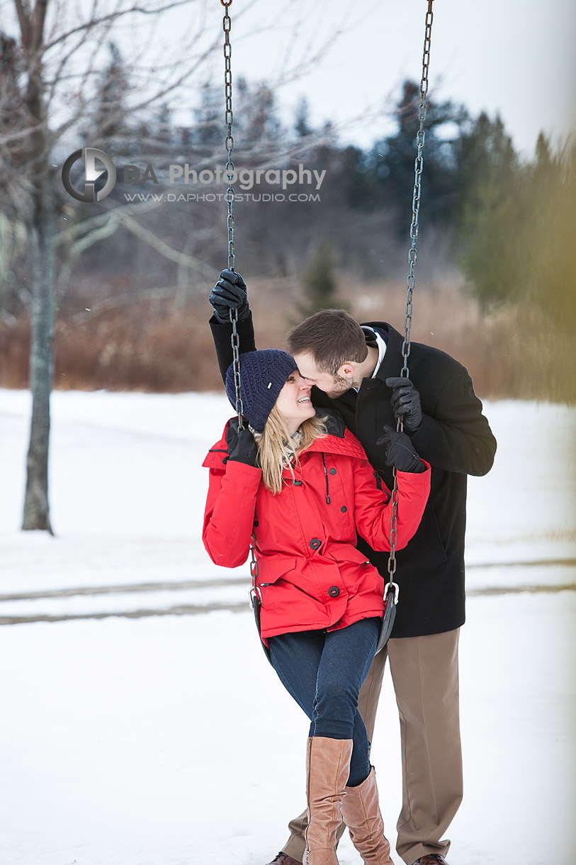 At the children playground - Winter Engagement photo shoot by DA Photography, www.daphotostudio.com