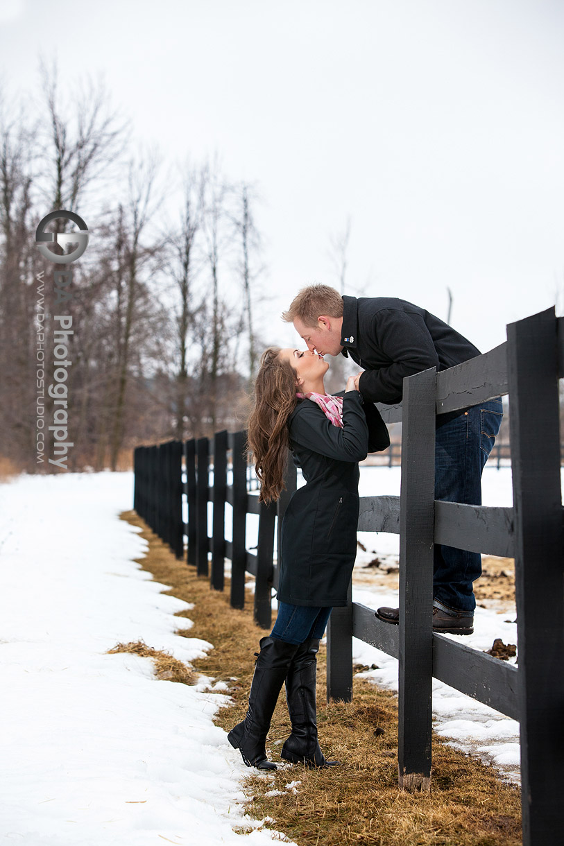 A Kiss on the Fence - Romantic engagement photos by DA Photography at Parish Ridge Stables in Burlington , www.daphotostudio.com