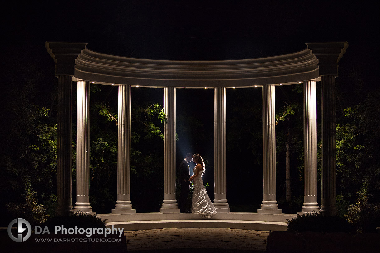 The kiss by the pillars at Paradise banquet hall on a Modern Italian Wedding