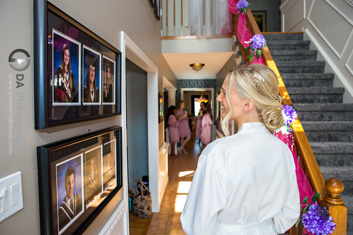 Bride look at her graduation photos