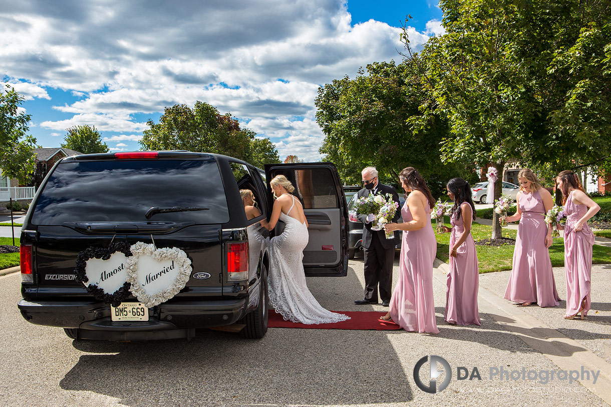 Bride getting into limo in Guelph