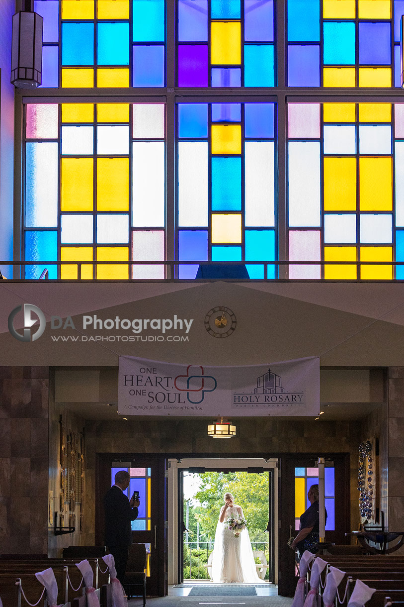 Bride entering a church at her wedding day