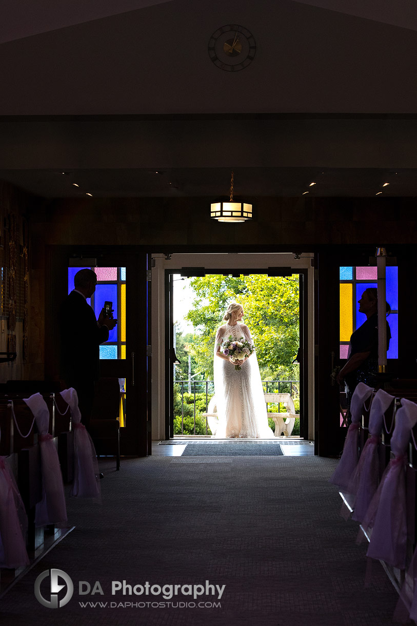 Bride entering a church at her wedding day in Guelph