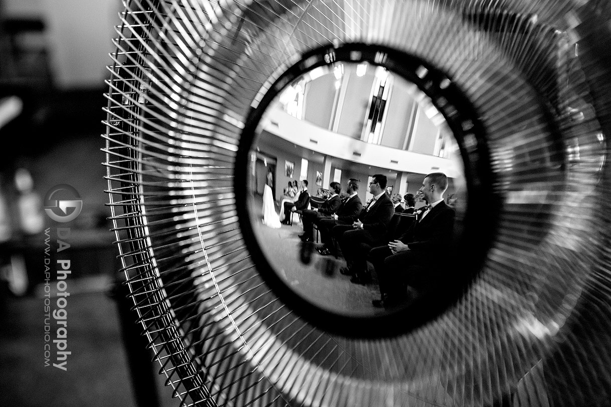 Reflection in a fan of groomsman's at Holy Rosary Church Wedding Ceremonies